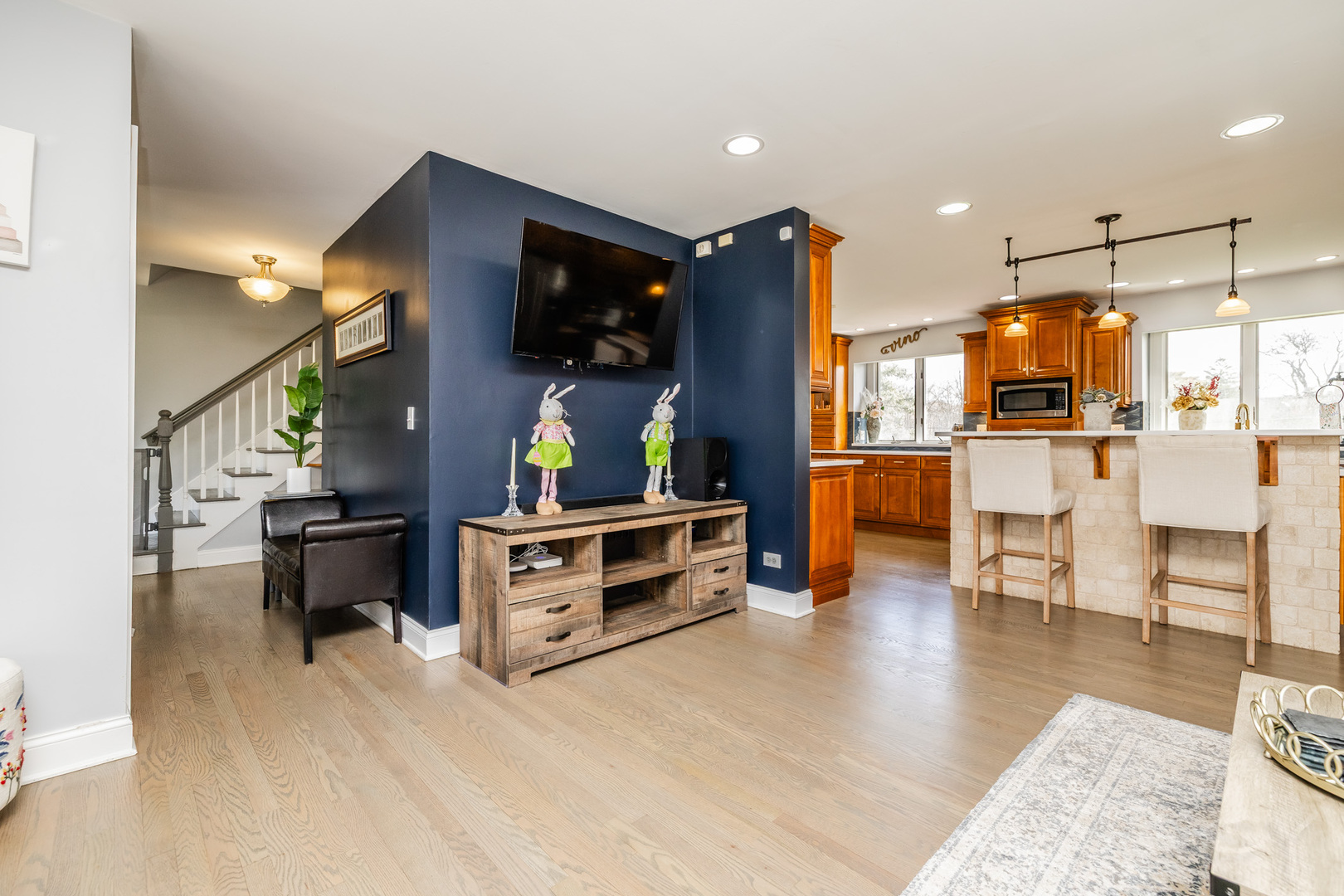 8001 William Drive Willowbrook, IL 60527 - Photo 17 of 73 a living room with furniture and a flat screen tv