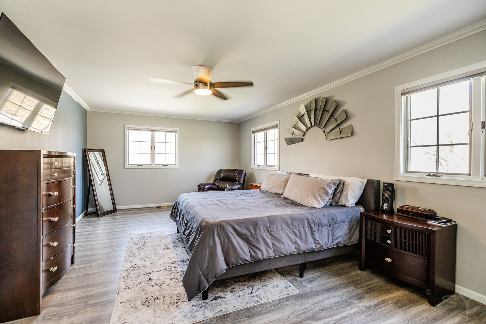 8001 William Drive Willowbrook, IL 60527 - Photo 21 of 73 a bedroom with a bed next to a window and a flat screen tv