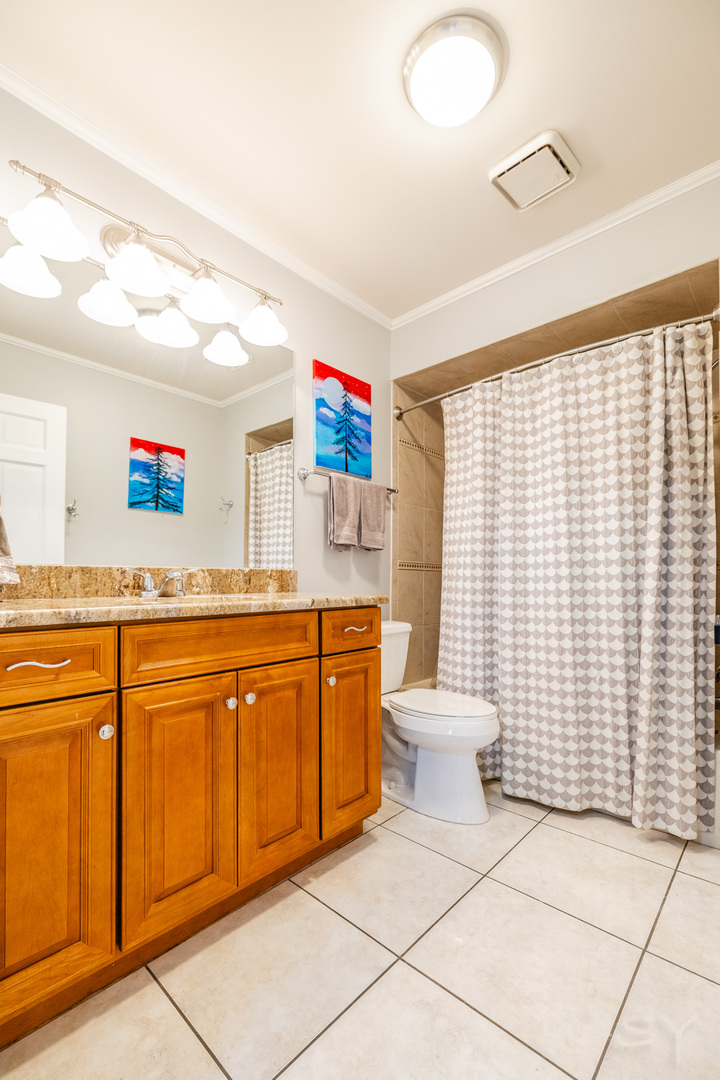 8001 William Drive Willowbrook, IL 60527 - Photo 32 of 73 a bathroom with a sink toilet vanity and mirror