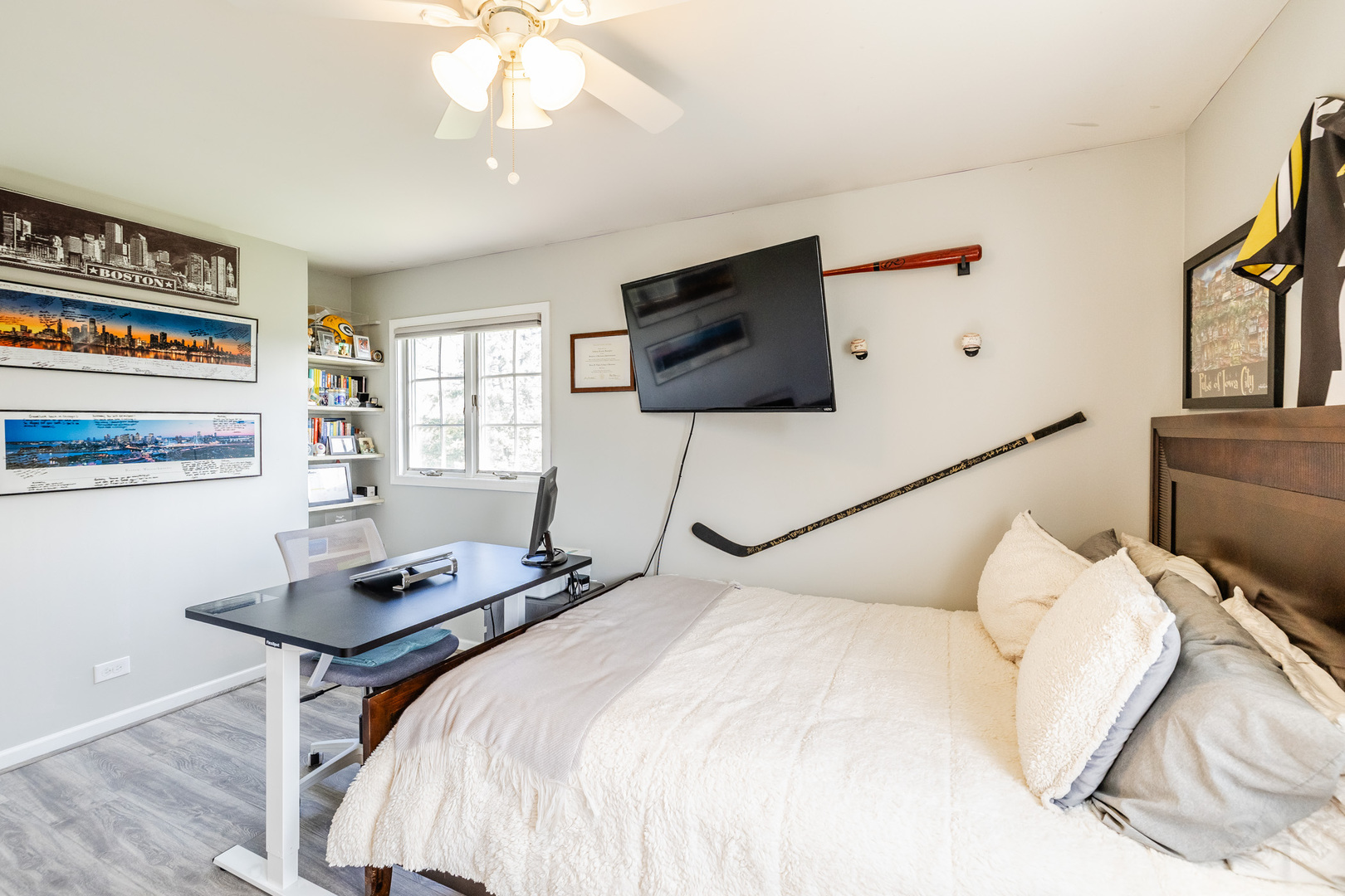 8001 William Drive Willowbrook, IL 60527 - Photo 34 of 73 a bedroom with a bed and a flat screen tv