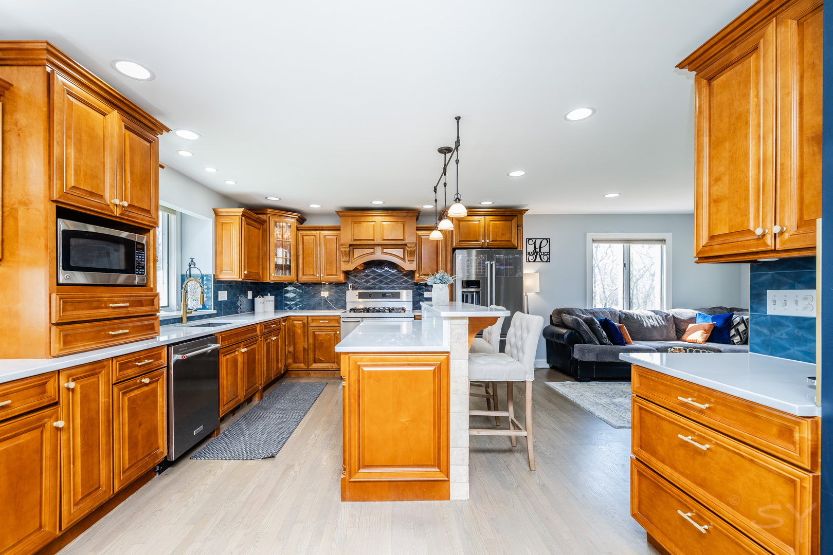 8001 William Drive Willowbrook, IL 60527 - Photo 4 of 73 a kitchen with stainless steel appliances granite countertop sink stove top oven and cabinets