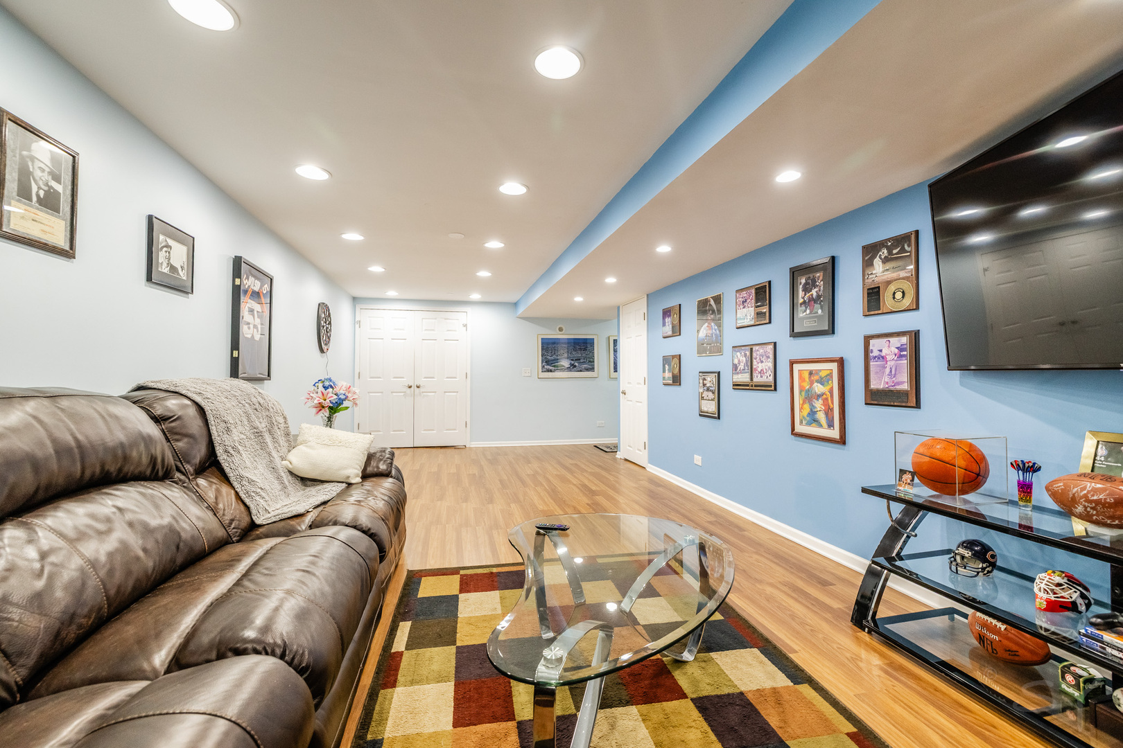 8001 William Drive Willowbrook, IL 60527 - Photo 42 of 73 a living room with furniture and a flat screen tv