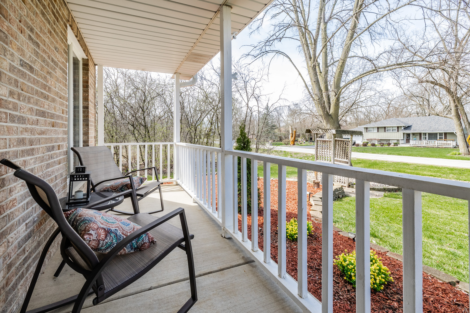 8001 William Drive Willowbrook, IL 60527 - Photo 50 of 73 a view of a balcony with wooden chairs
