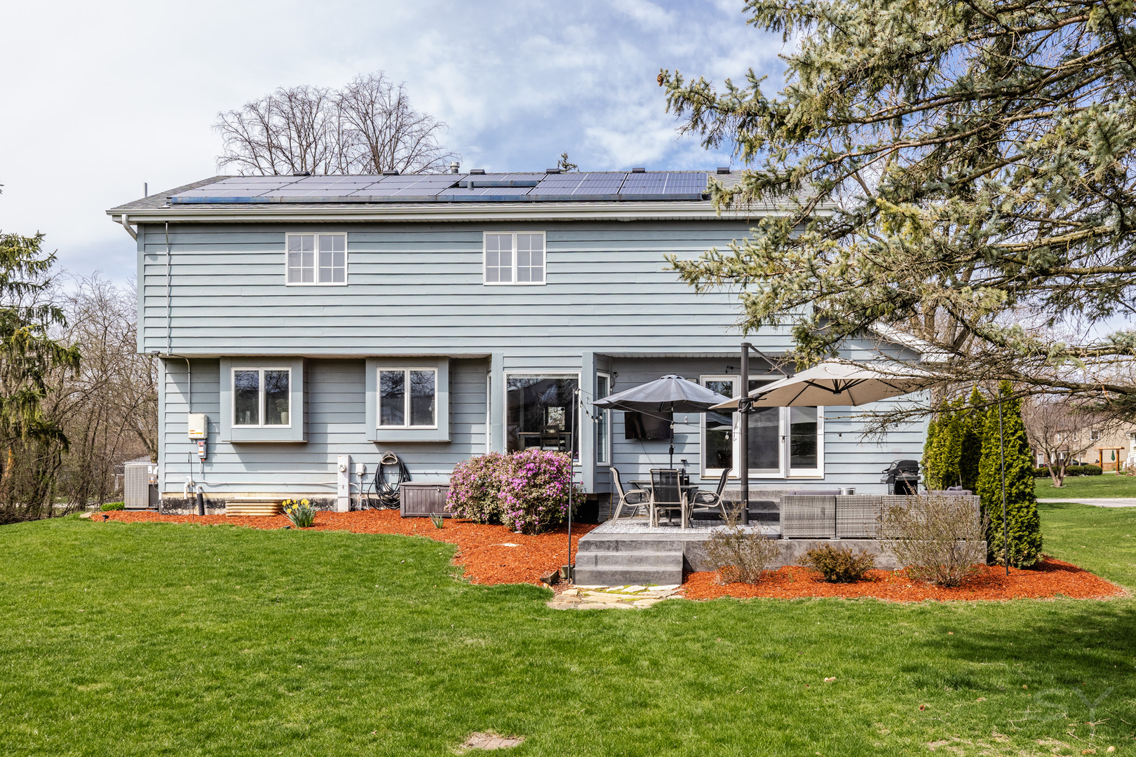 8001 William Drive Willowbrook, IL 60527 - Photo 52 of 73 a front view of a house with swimming pool and chairs