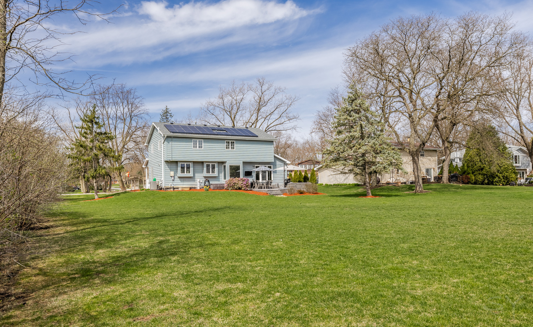 8001 William Drive Willowbrook, IL 60527 - Photo 66 of 73 a view of a big yard with a house in the background