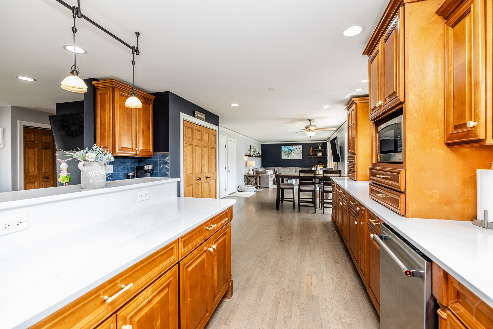 8001 William Drive Willowbrook, IL 60527 - Photo 10 of 73 a kitchen with stainless steel appliances granite countertop sink stove top oven and cabinets
