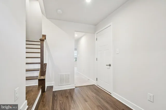 a view of entryway with wooden floor