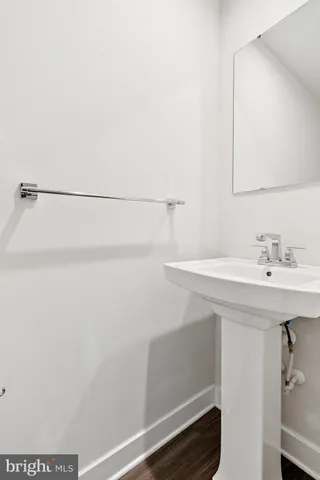 a bathroom with a sink and mirror