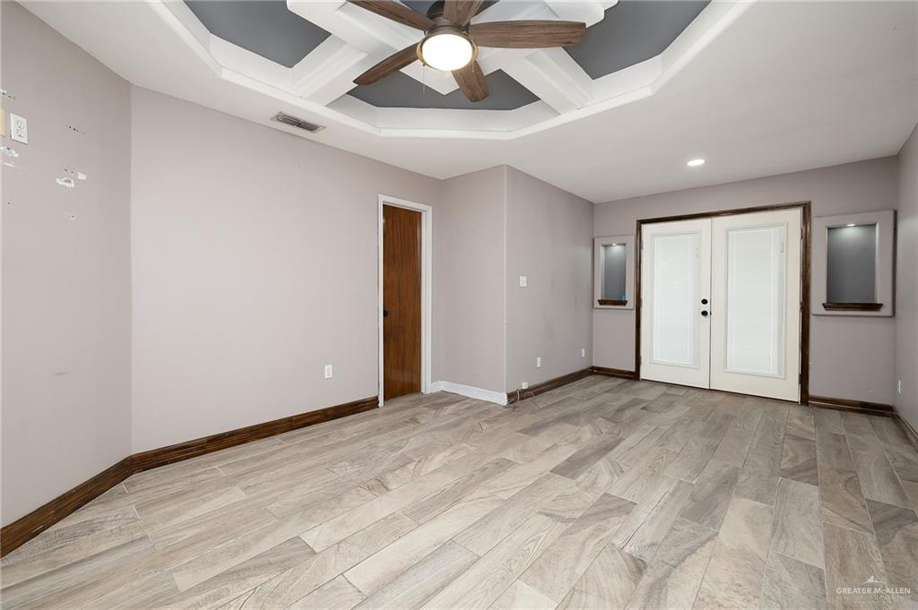 6112 Davis Lane Mission, TX 78574 - Photo 8 of 23 an empty room with a ceiling fan and carpet