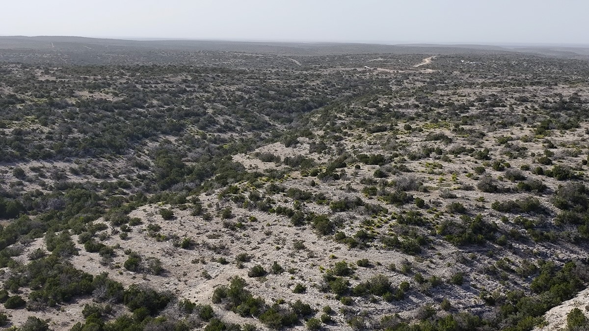 0 Marvin Road Comstock, TX 78837 - Photo 31 of 40 an aerial view of house with yard and mountain view in back