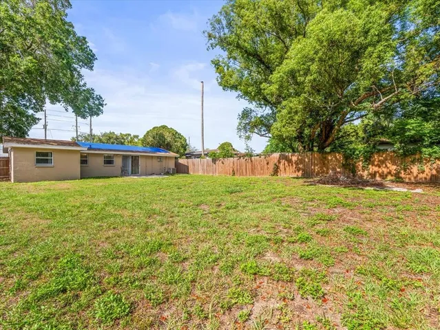 a view of a field with an trees