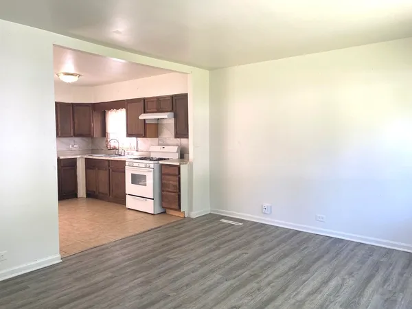 a view of kitchen with wooden floor