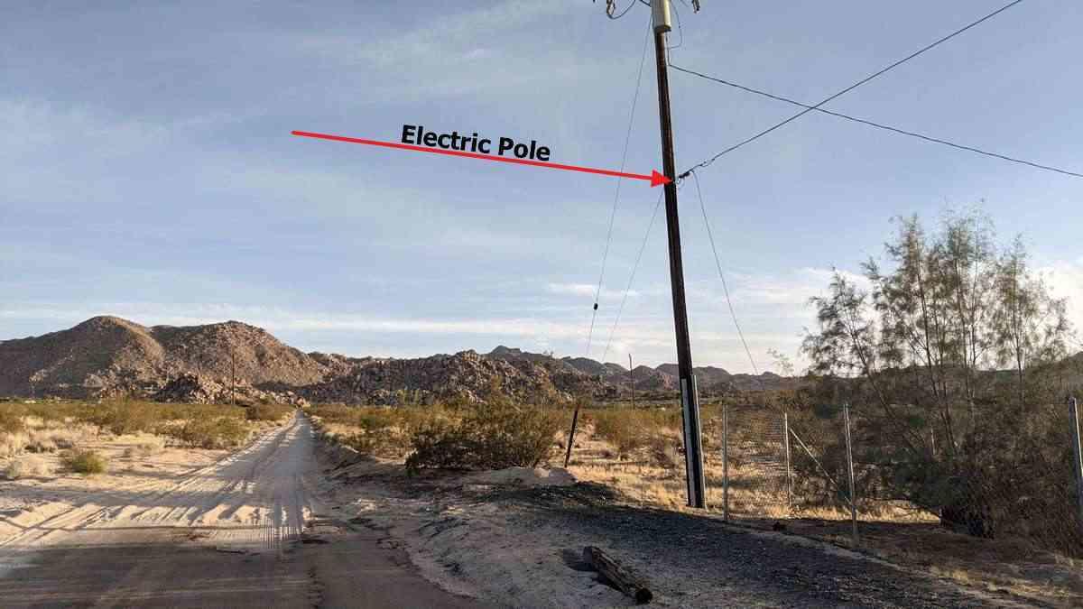 6742 Mile Square Road Joshua Tree, CA 92252 - Photo 5 of 13 a view of a road with a building in the background