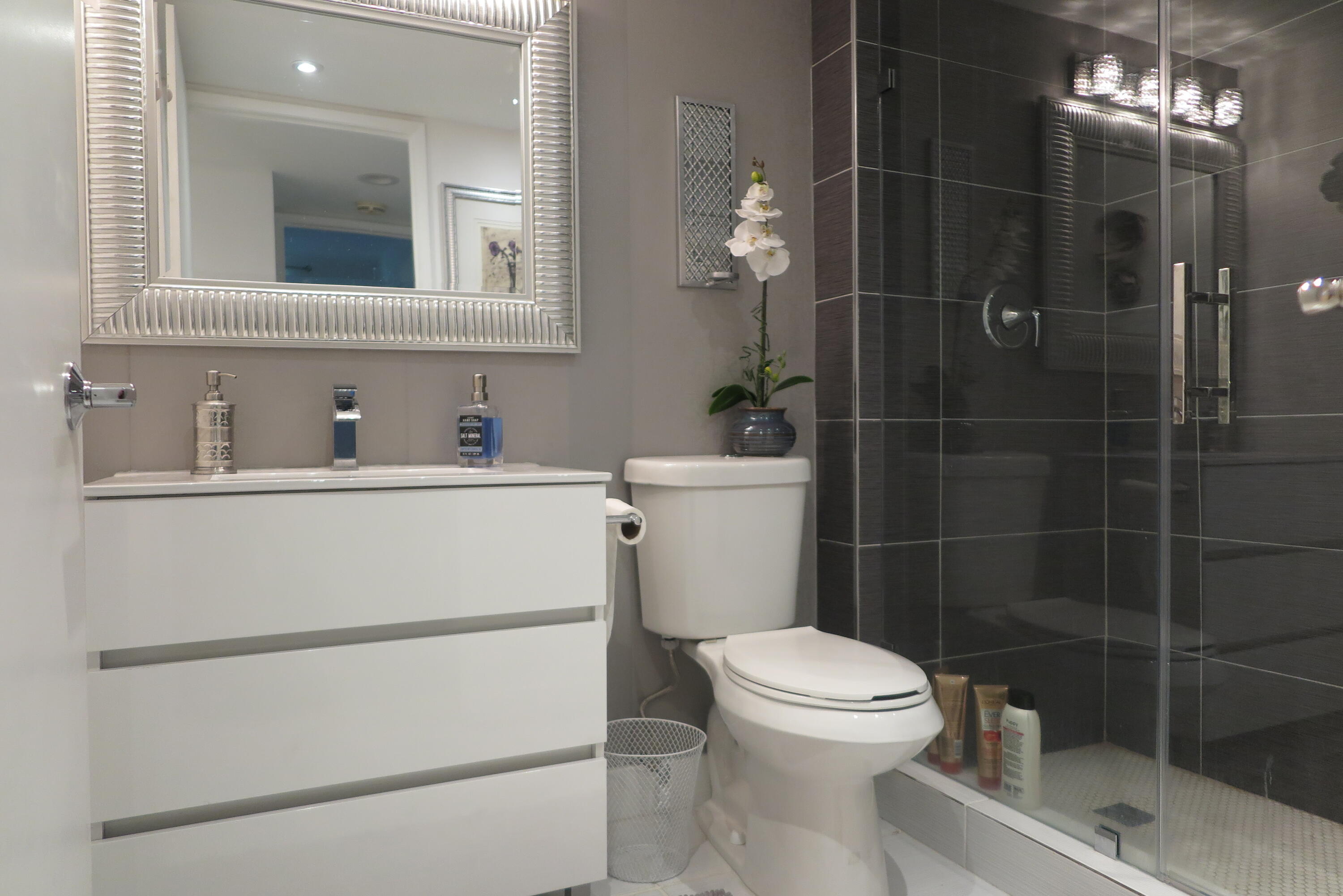 7875 La Mirada Drive Boca Raton, FL 33433 - Photo 19 of 31 a bathroom with a toilet sink and shower