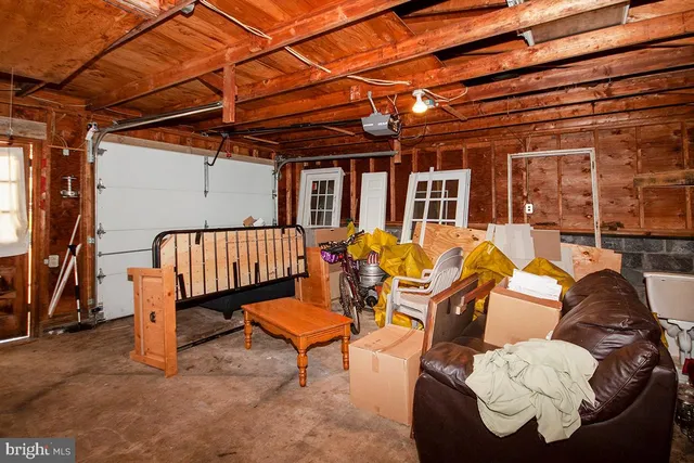 a view of a patio with a table and chairs