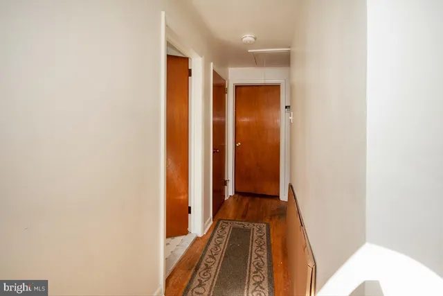 a view of room with wooden floor