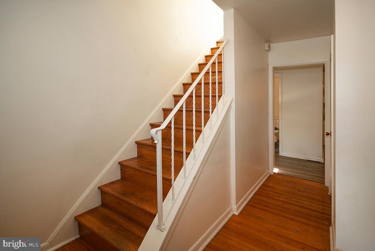 316 Swarthmore Road Glassboro, NJ 08028 - Photo 14 of 30 a view of staircase with wooden floor and white walls