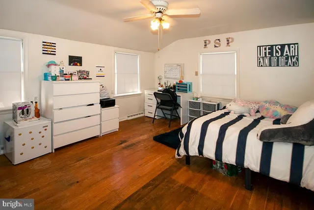 a bedroom with a bed and a dresser