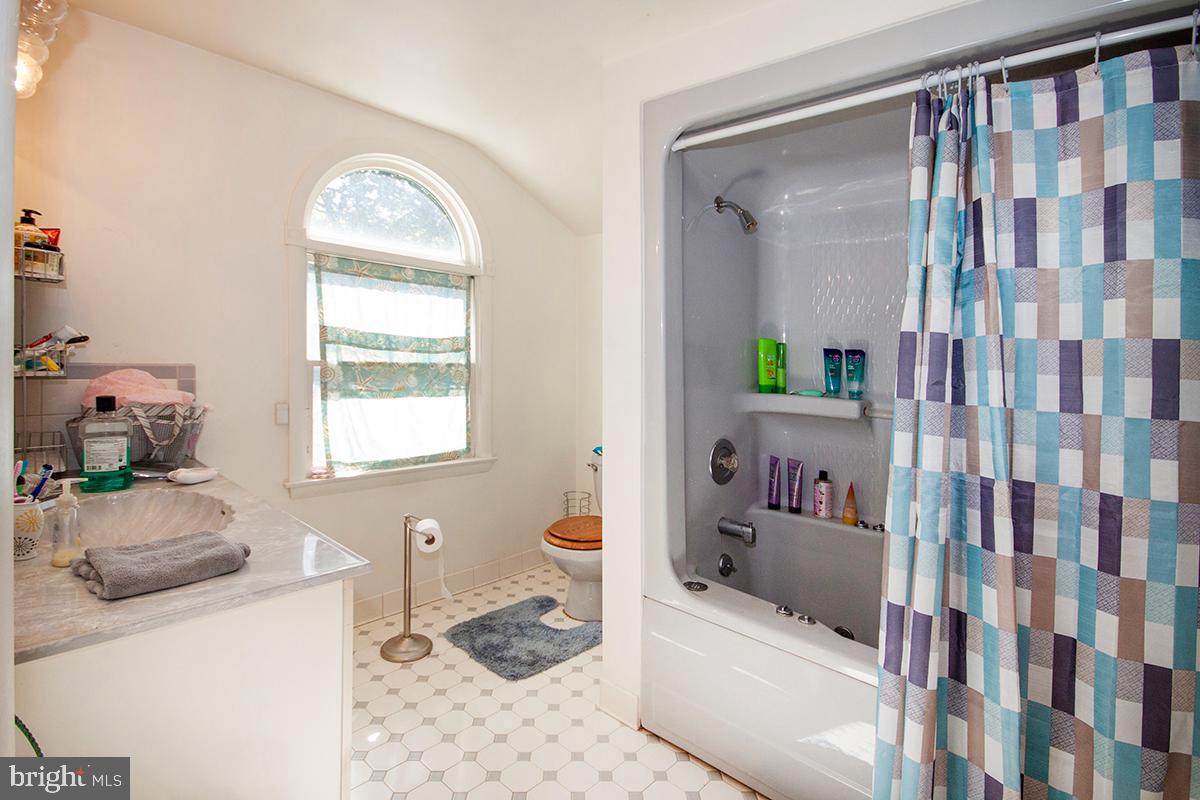 316 Swarthmore Road Glassboro, NJ 08028 - Photo 25 of 30 a bathroom with a bathtub sink and toilet