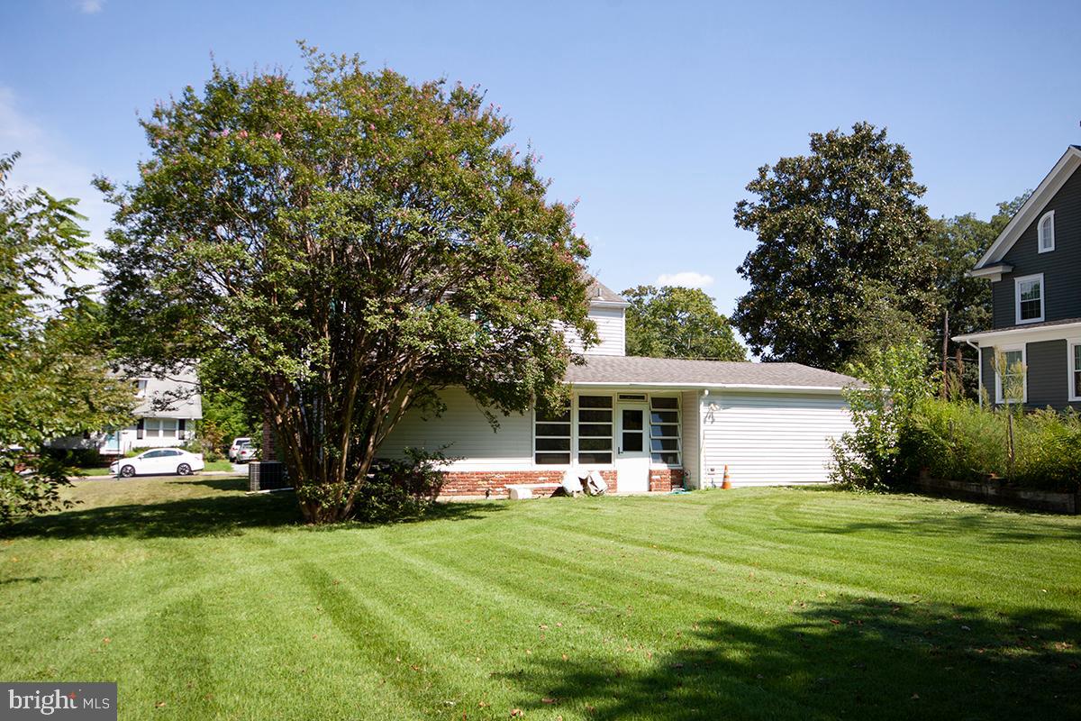 316 Swarthmore Road Glassboro, NJ 08028 - Photo 29 of 30 a front view of a house with a garden and trees