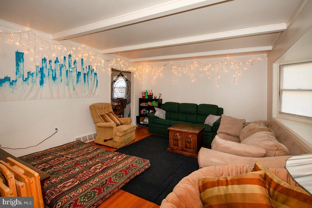 316 Swarthmore Road Glassboro, NJ 08028 - Photo 6 of 30 a living room with furniture and a floor to ceiling window