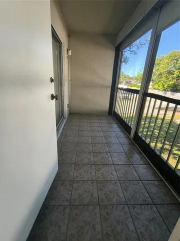 an empty room with a empty space and a ceiling fan