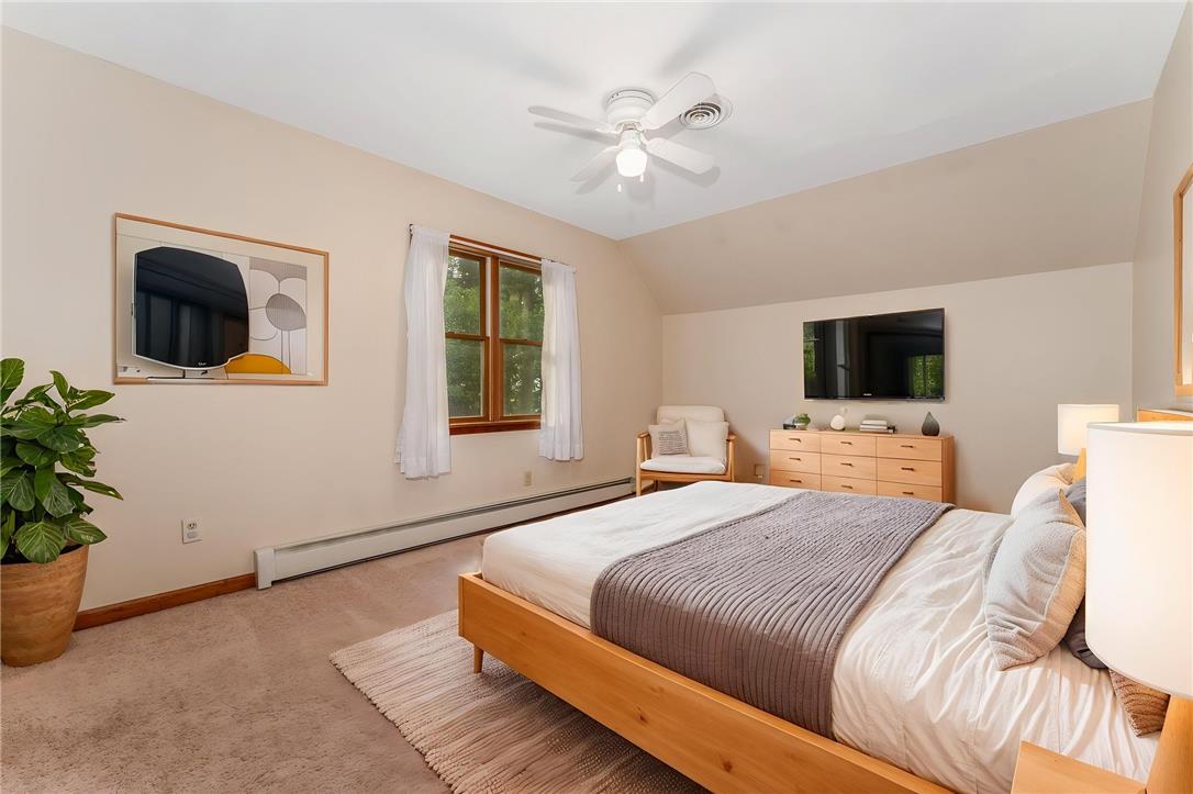 465 Raubsville Road Easton, PA 18042 - Photo 35 of 60 A tranquil sleeping chamber with a vaulted ceiling and a wide window that illuminates the room.