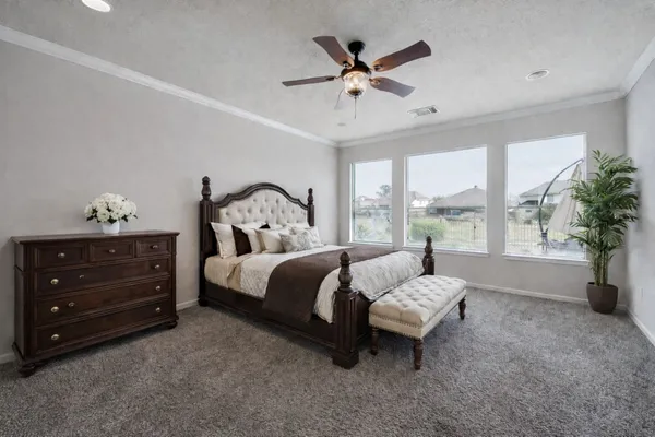 a bed room with a bed and a window