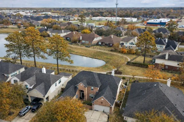 an aerial view of residential houses with outdoor space