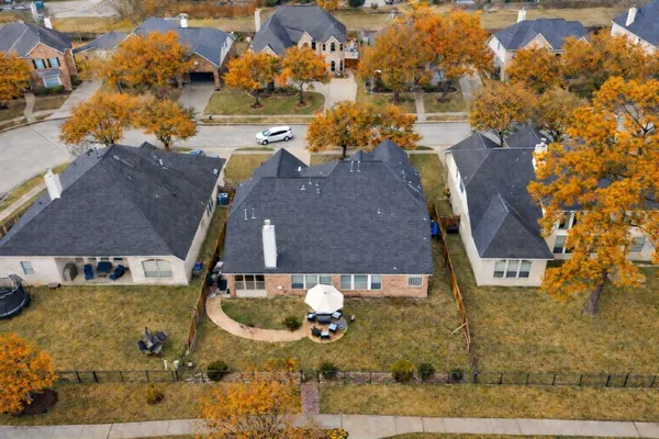 an aerial view of a house with outdoor space