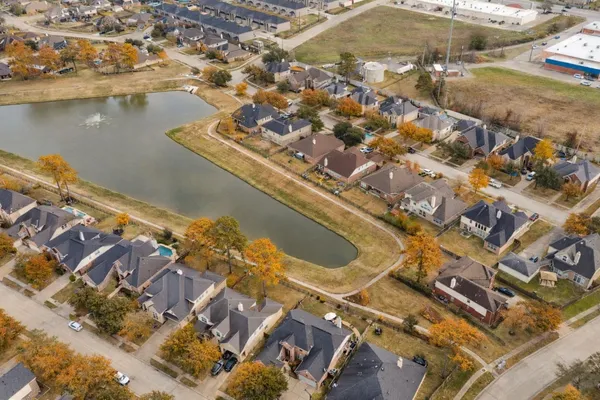an aerial view of residential houses with outdoor space
