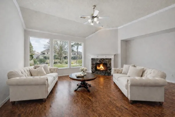 a living room with furniture and a fireplace