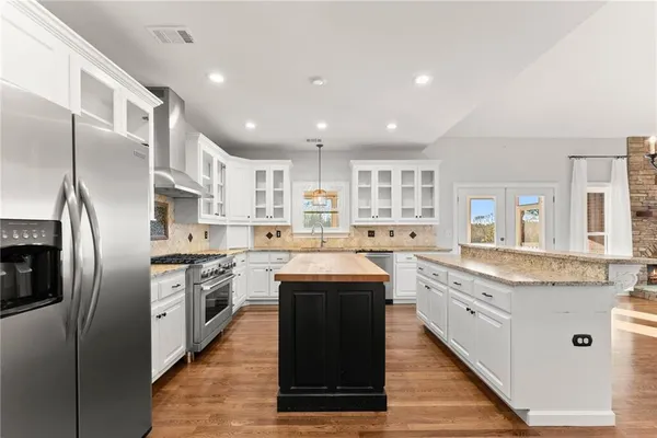 a living room with furniture fireplace and a flat screen tv