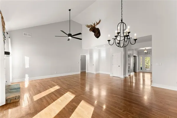a bathroom with a double vanity sink toilet and a mirror