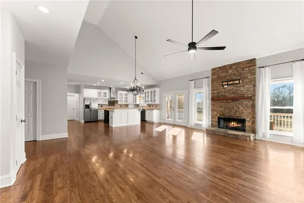 a view of an empty room and wooden floor