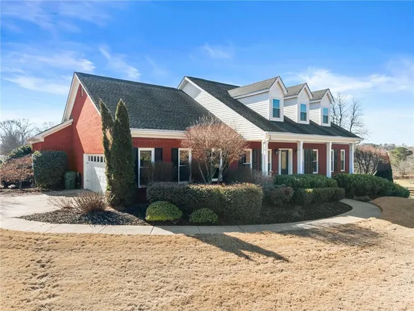 a front view of a house with a yard
