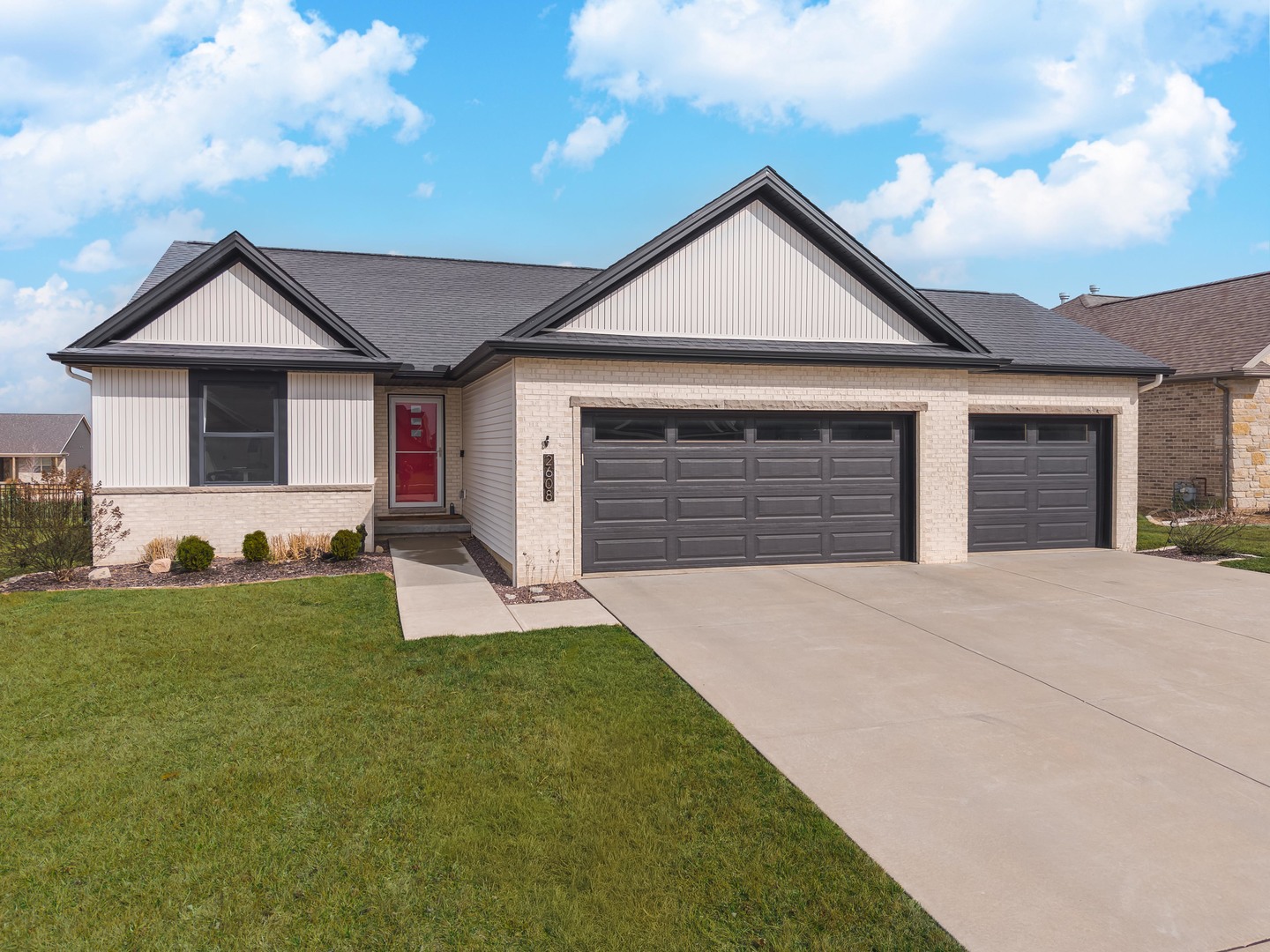 2608 Shale Road Normal, IL 61761 - Photo 1 of 39 a front view of a house with a yard and garage