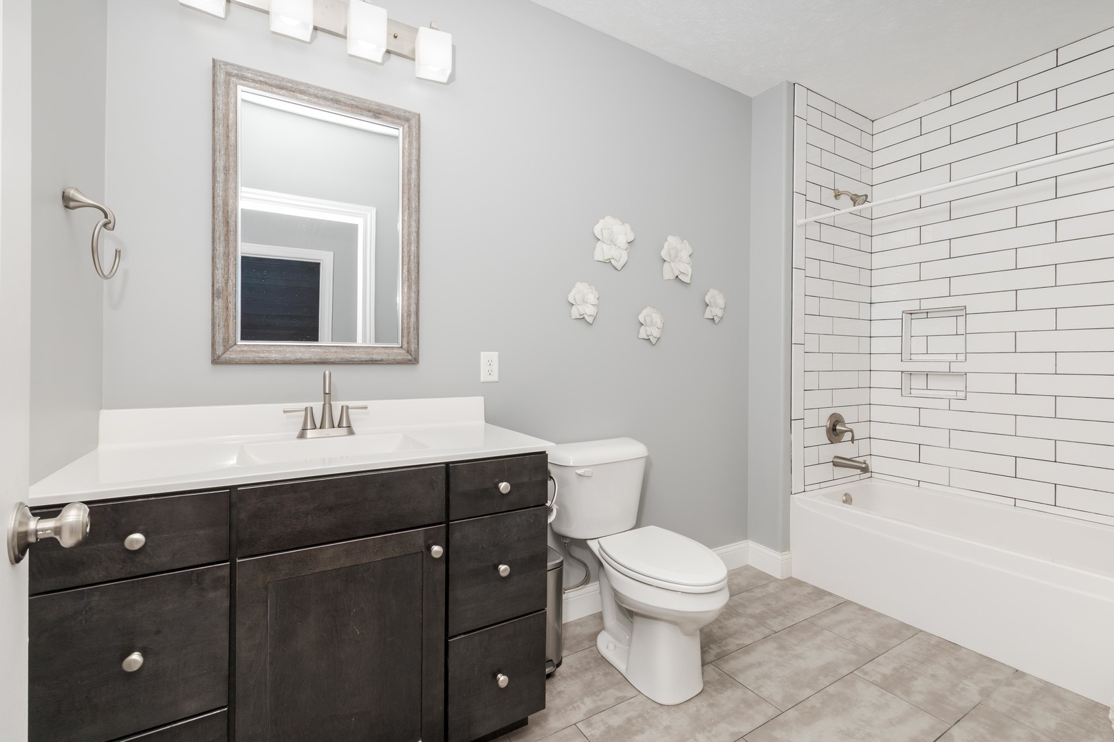 2608 Shale Road Normal, IL 61761 - Photo 34 of 39 a bathroom with a toilet a sink a tub and mirror