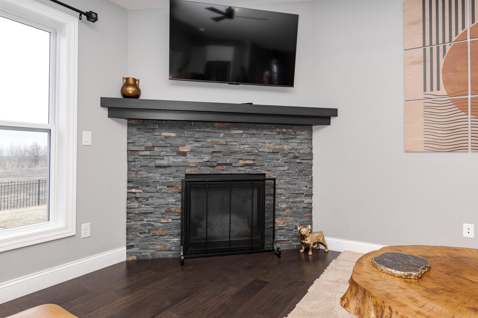 2608 Shale Road Normal, IL 61761 - Photo 9 of 39 a living room with a fireplace and a wooden floor