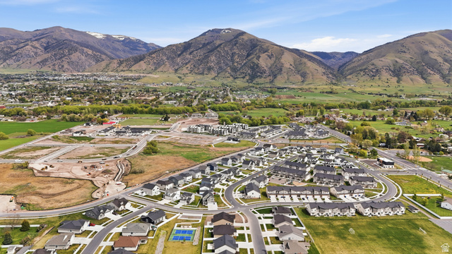 401 West 3085 South, Unit 329 Nibley, UT 84321 - Photo 30 of 34 Aerial perspective of suburban area featuring a mountainous background