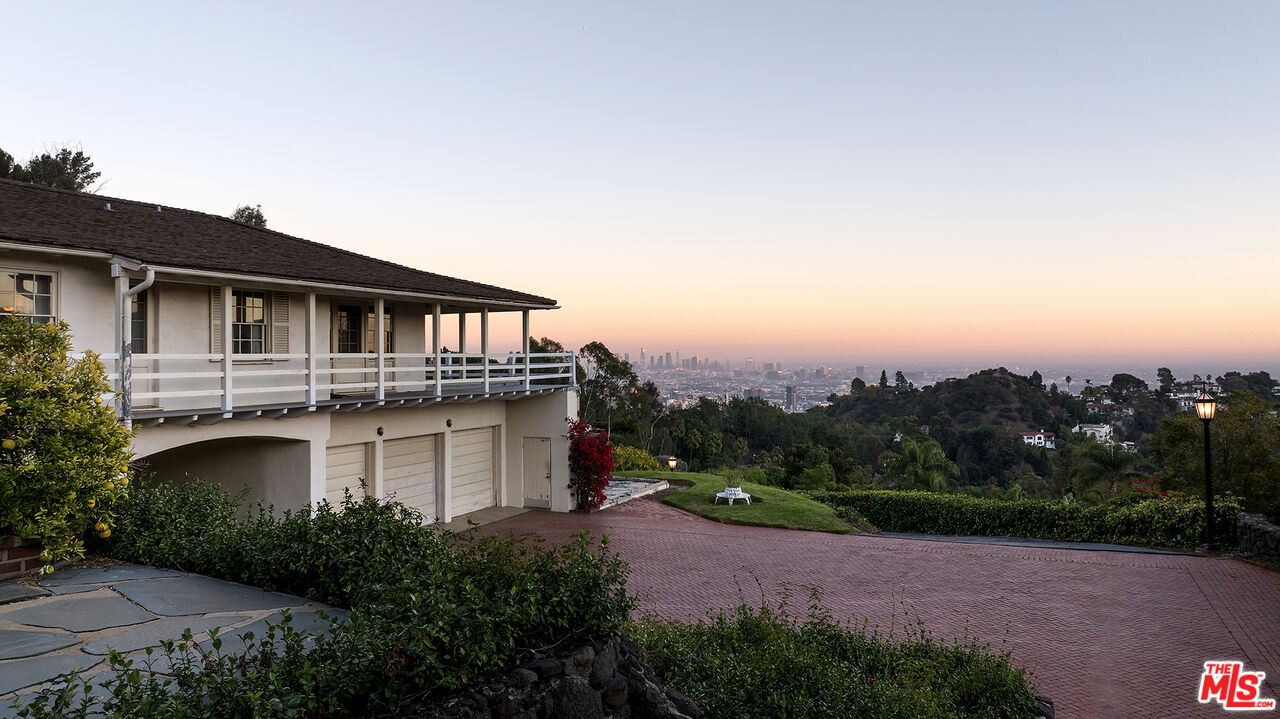 7141 Senalda Road Los Angeles, CA 90068 - Photo 1 of 26 an aerial view of a house with a garden