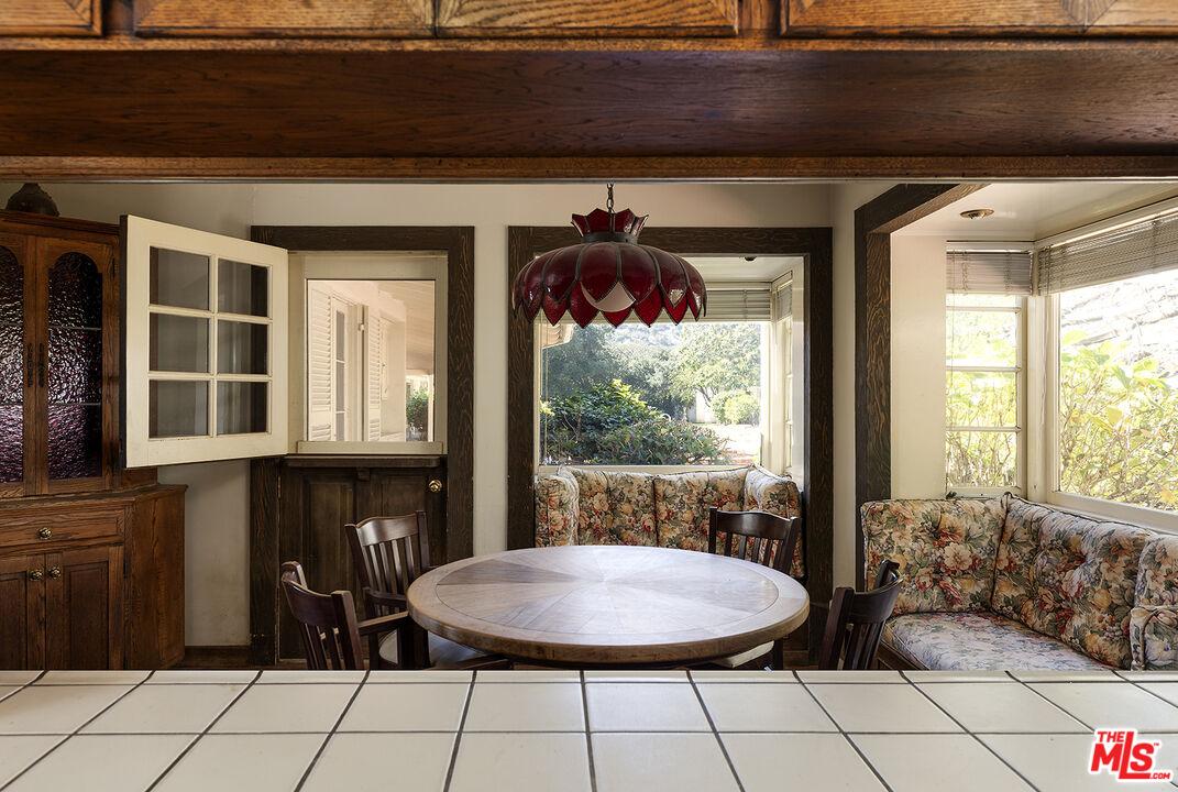 7141 Senalda Road Los Angeles, CA 90068 - Photo 12 of 26 a dining room with furniture and window