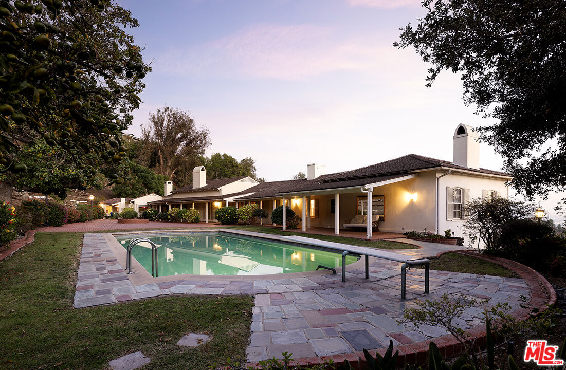 7141 Senalda Road Los Angeles, CA 90068 - Photo 4 of 26 a front view of a house with a yard table and chairs