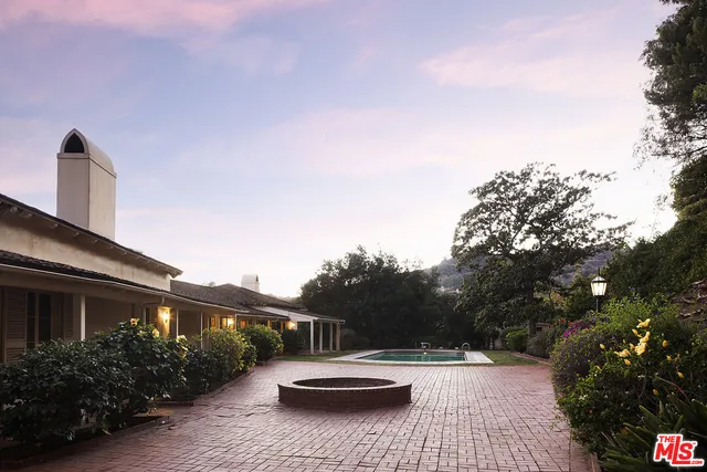 a view of swimming pool with a patio