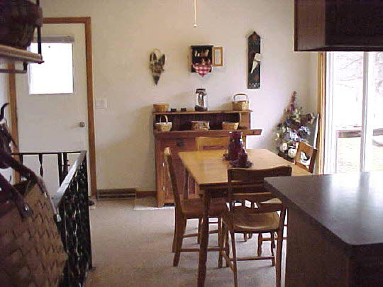 1971 North Meridian Road Chana, IL 61015 - Photo 3 of 8 a view of a dining room with furniture and a window