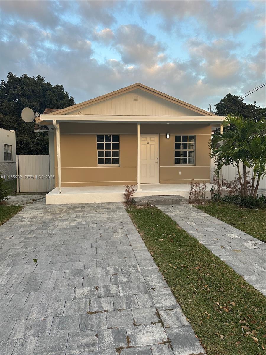 front view of a house with a yard