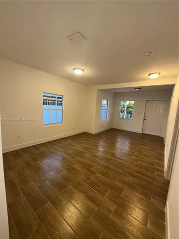a view of an empty room and window