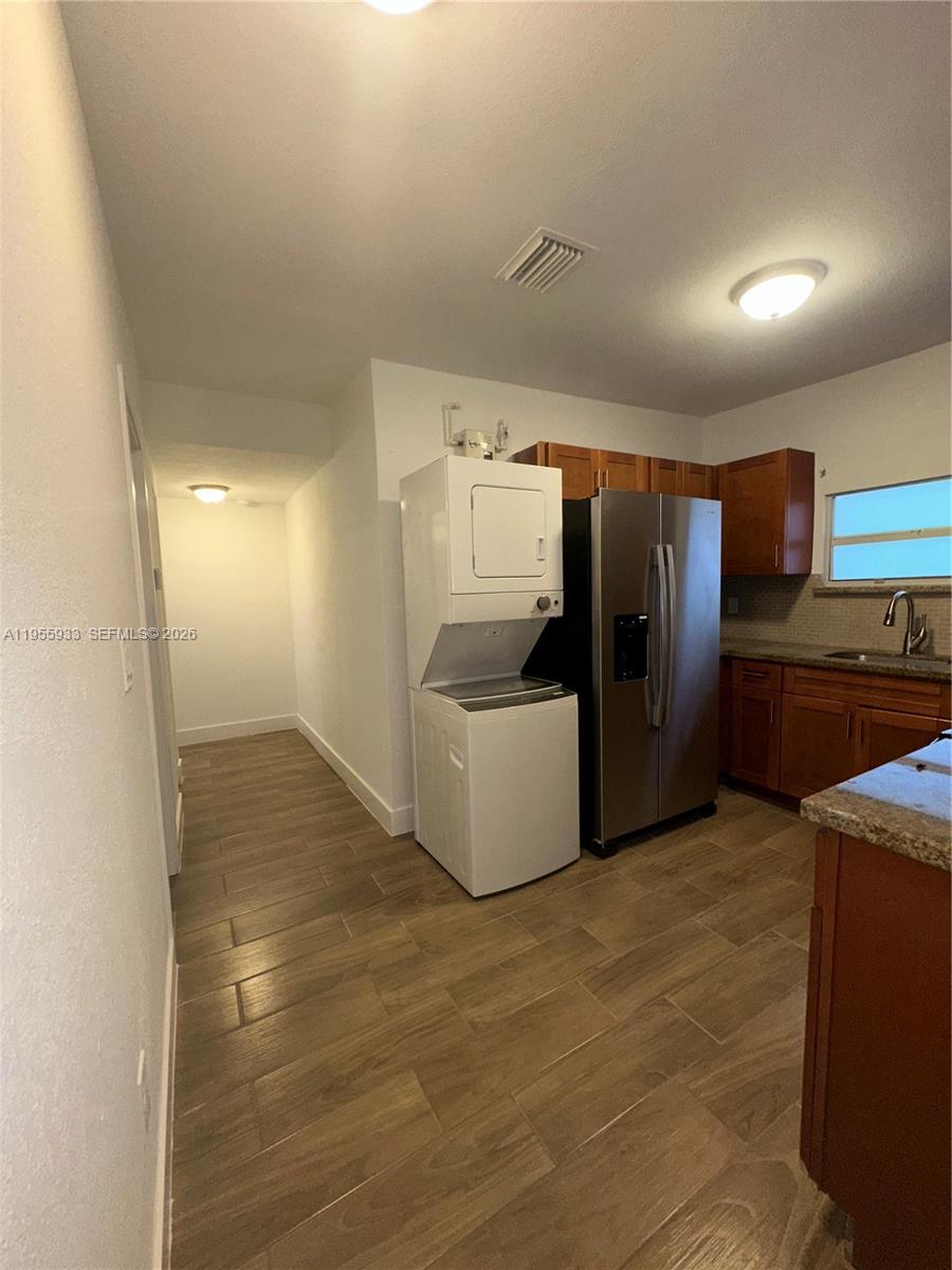 3123 Northwest 22nd Court, Unit A Miami, FL 33142 - Photo 10 of 18 a view of a refrigerator in kitchen and a sink