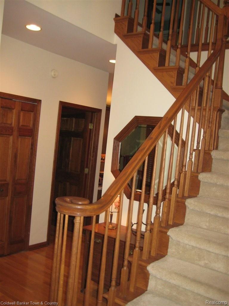 7562 Summit Ridge Brighton, MI 48116 - Photo 15 of 19 Oak Staircase