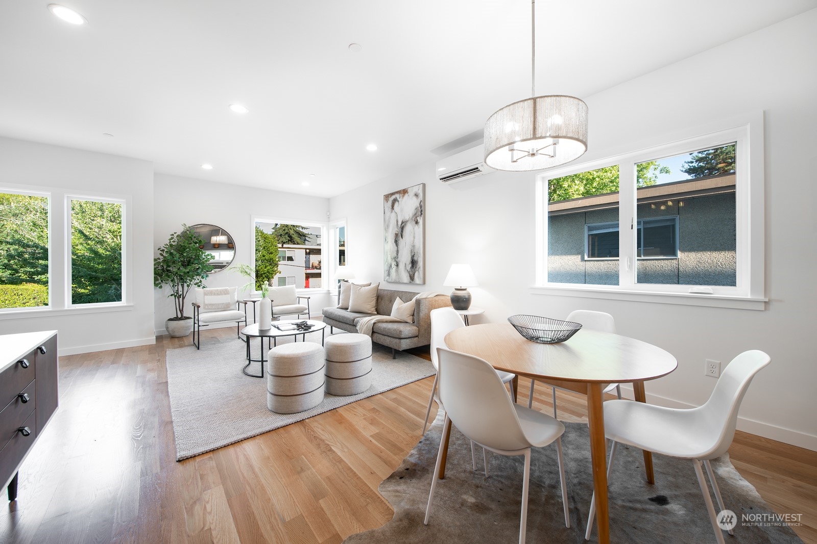 3649 Francis Avenue North, Unit A Seattle, WA 98103 - Photo 11 of 35 a view of a dining room with furniture wooden floor and chandelier